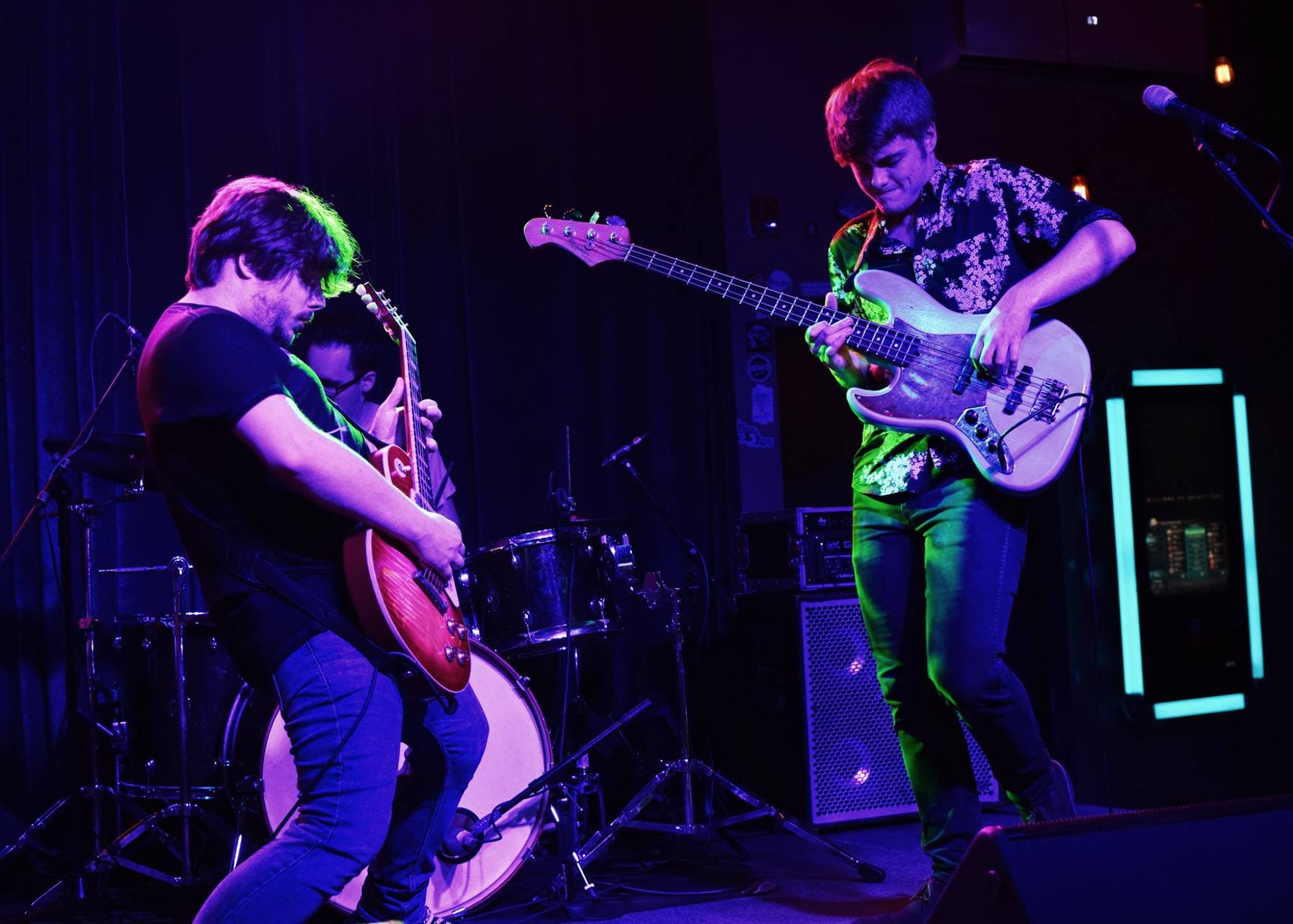 Individually Twisted performing at Barrelhouse South in purple and green lighting